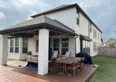 A Houston home protected from water damage with a professionally installed gutter system by AC Houston Seamless Gutters.