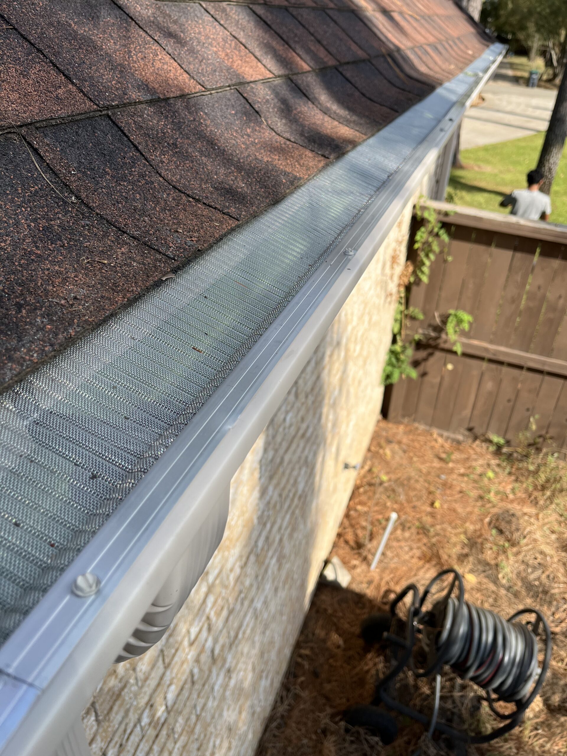 AC Houston Team working on seamless gutters