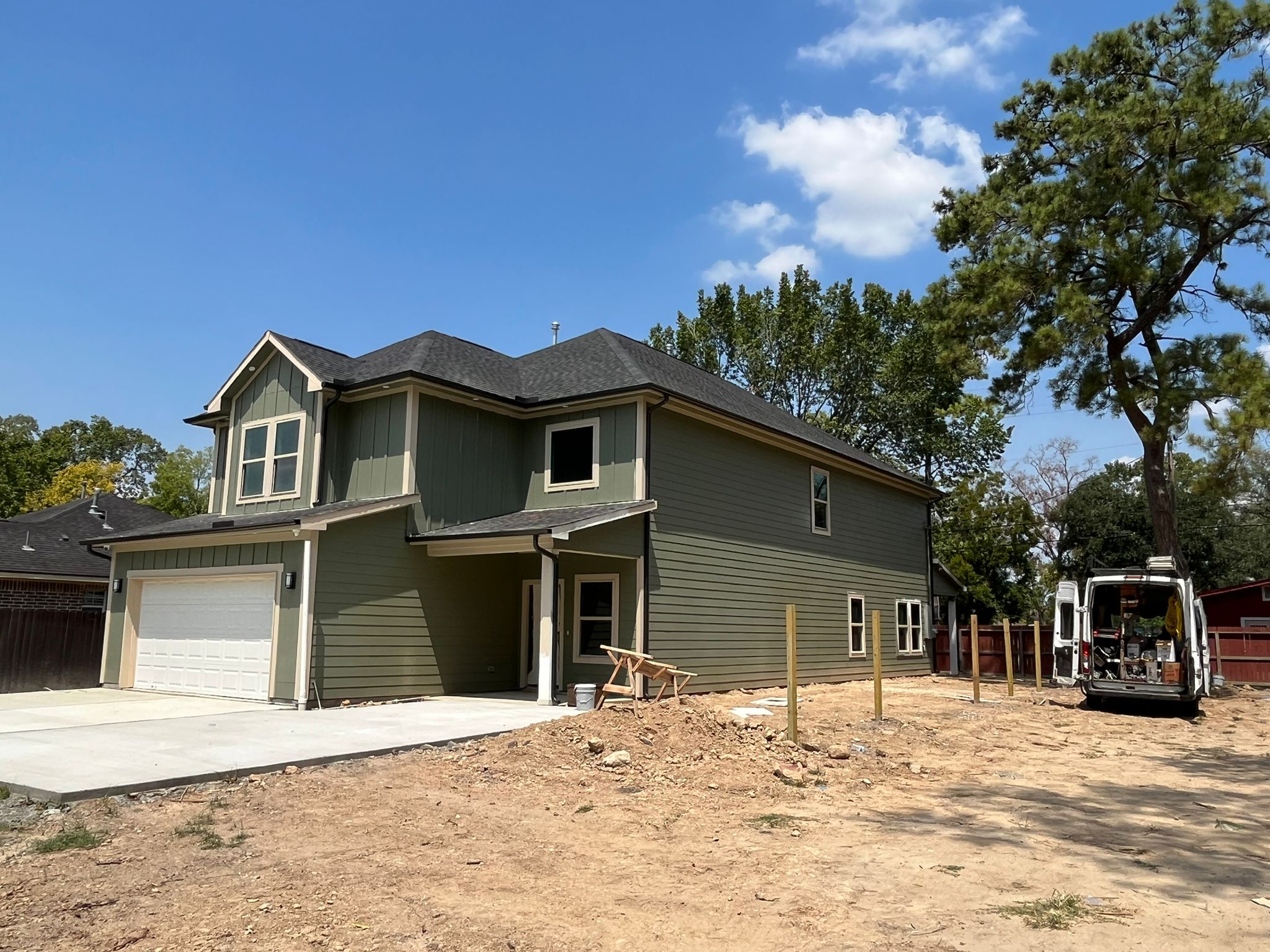 New two-story home with white seamless gutters
