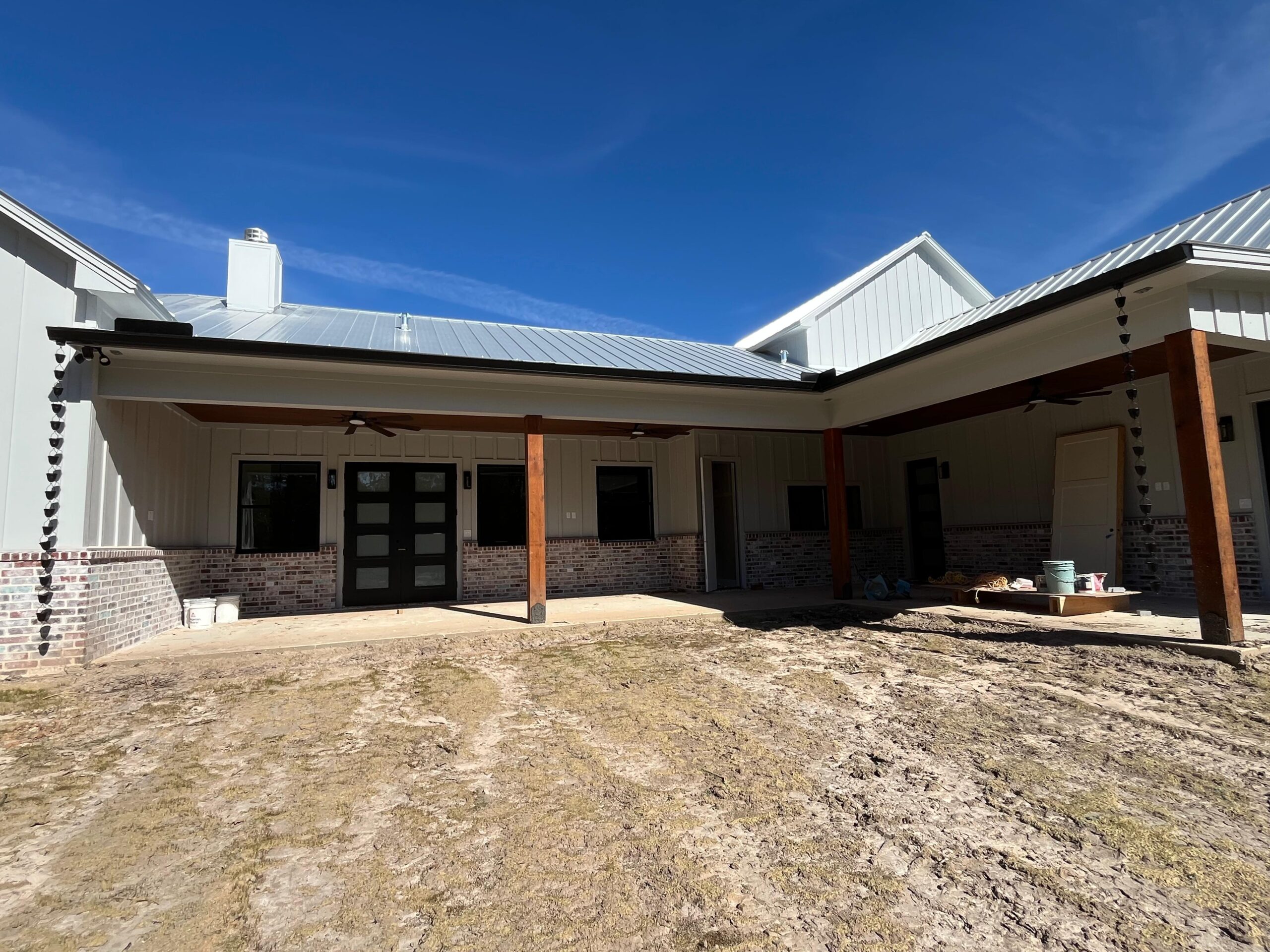 Covered patio with seamless gutters after installation
