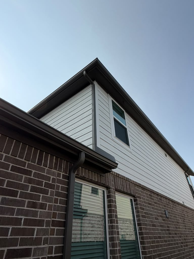 Clean seamless gutter line after replacement